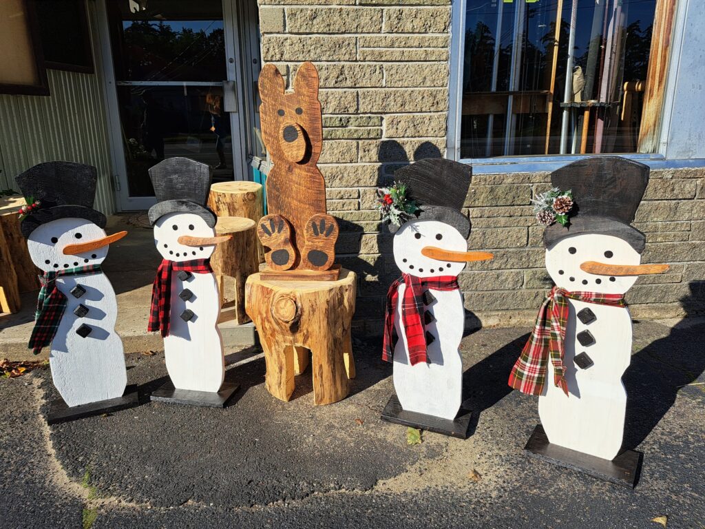 Wooden snowmen and bear