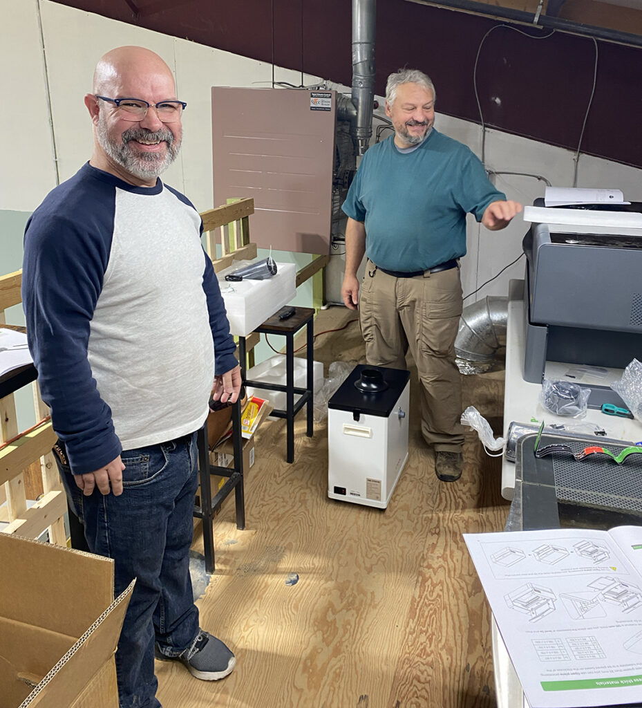 Laser cutting floor with smiling people.